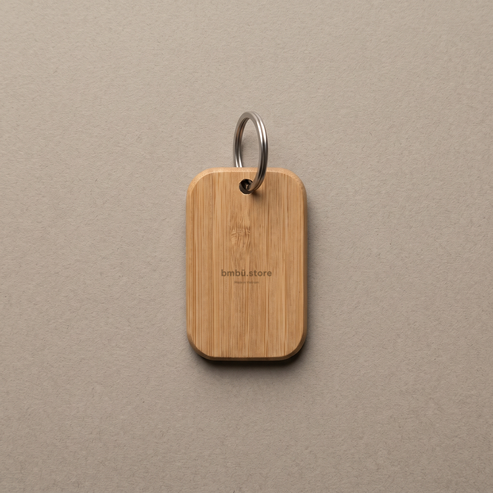 Bamboo key tag brand face — bmbū.store wordmark