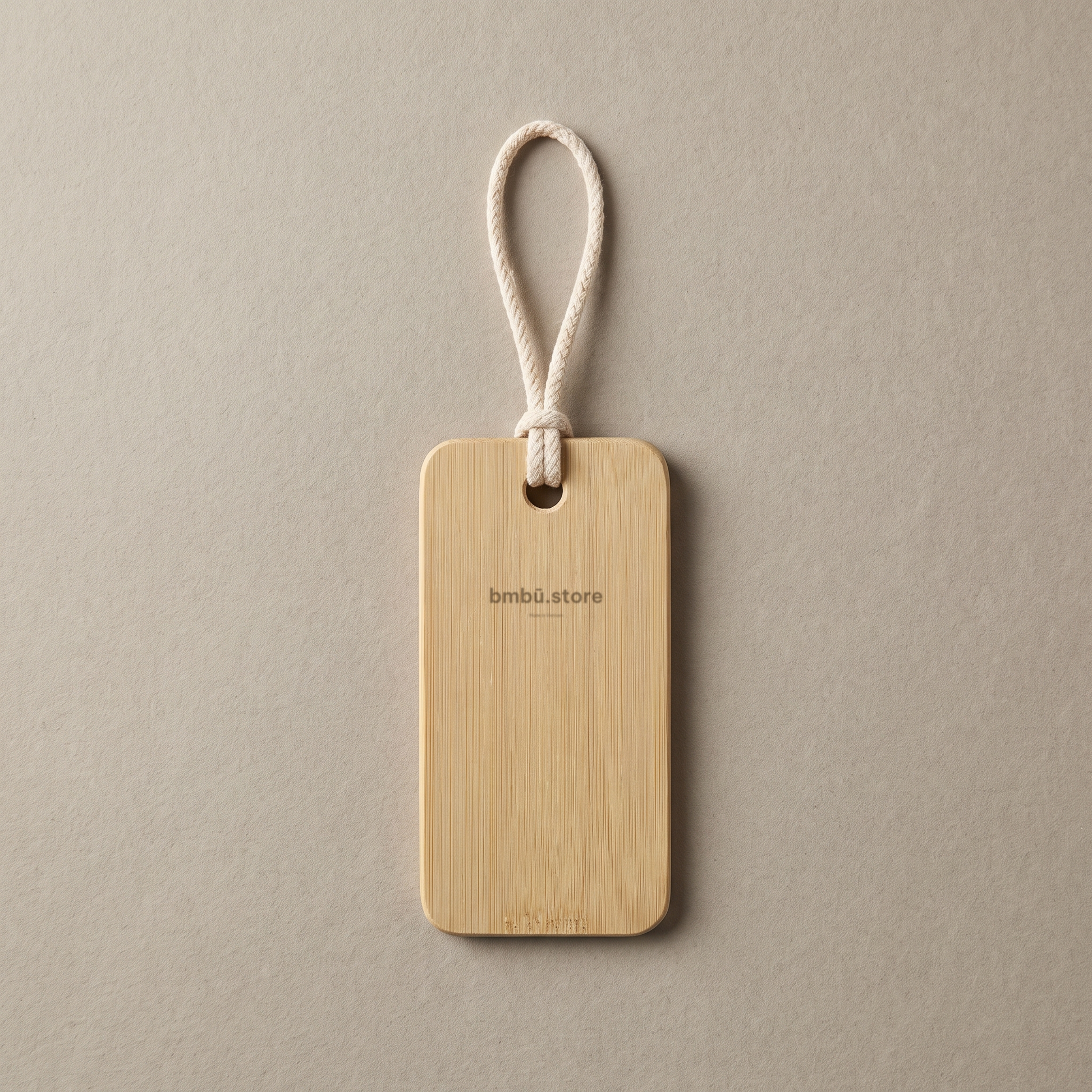 Bamboo travel tag brand face — bmbū.store wordmark