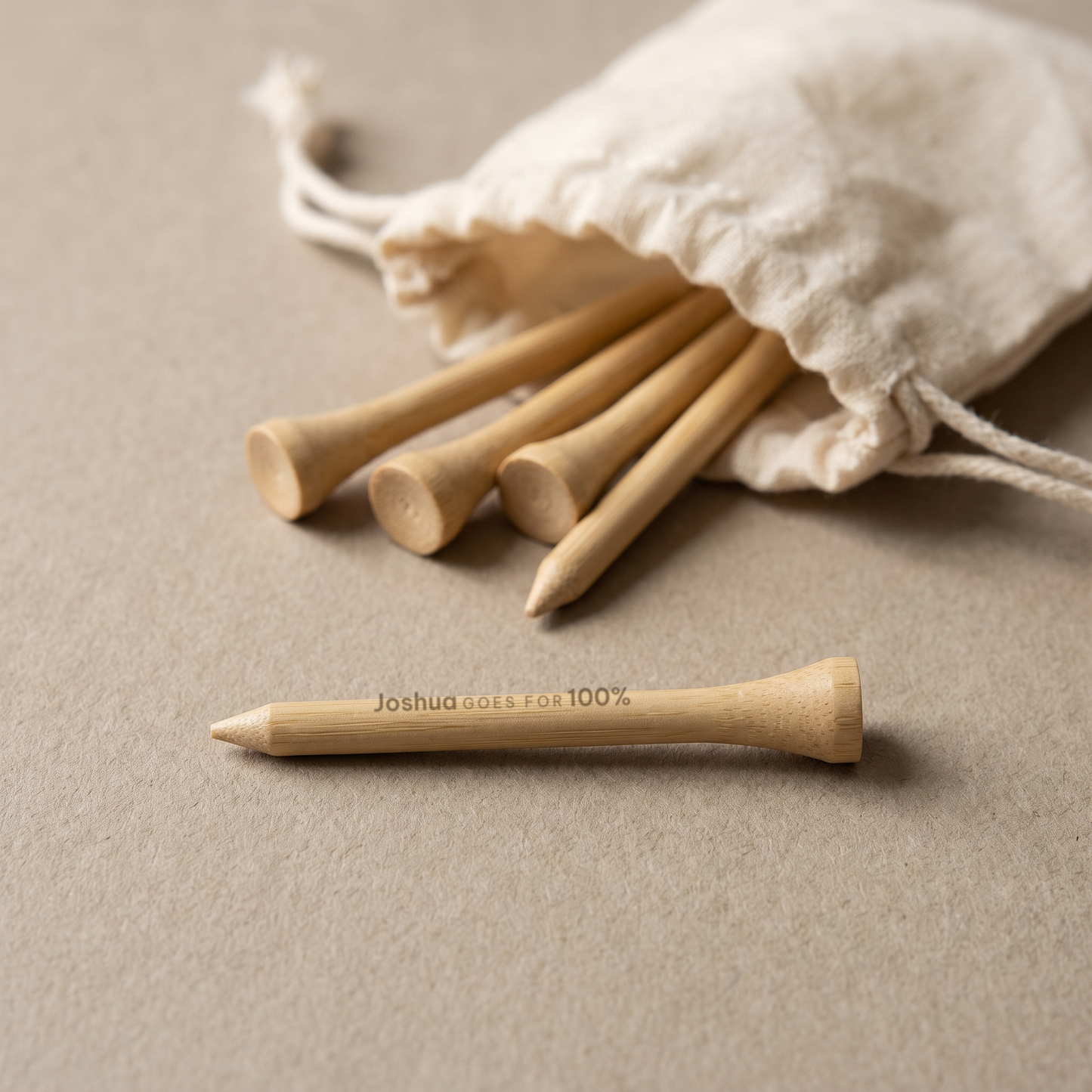 Bamboo golf tees engraved Joshua GOES FOR 100%