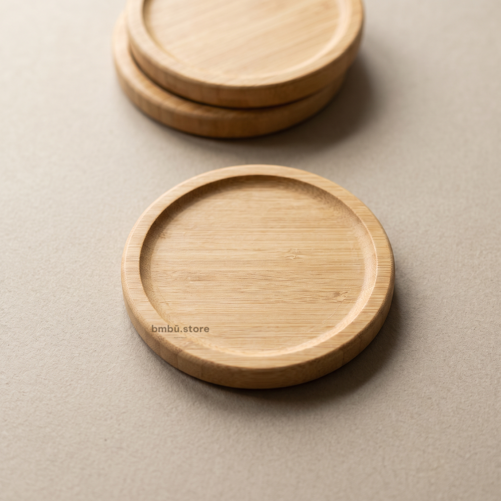 Bamboo coaster brand face — bmbū.store wordmark