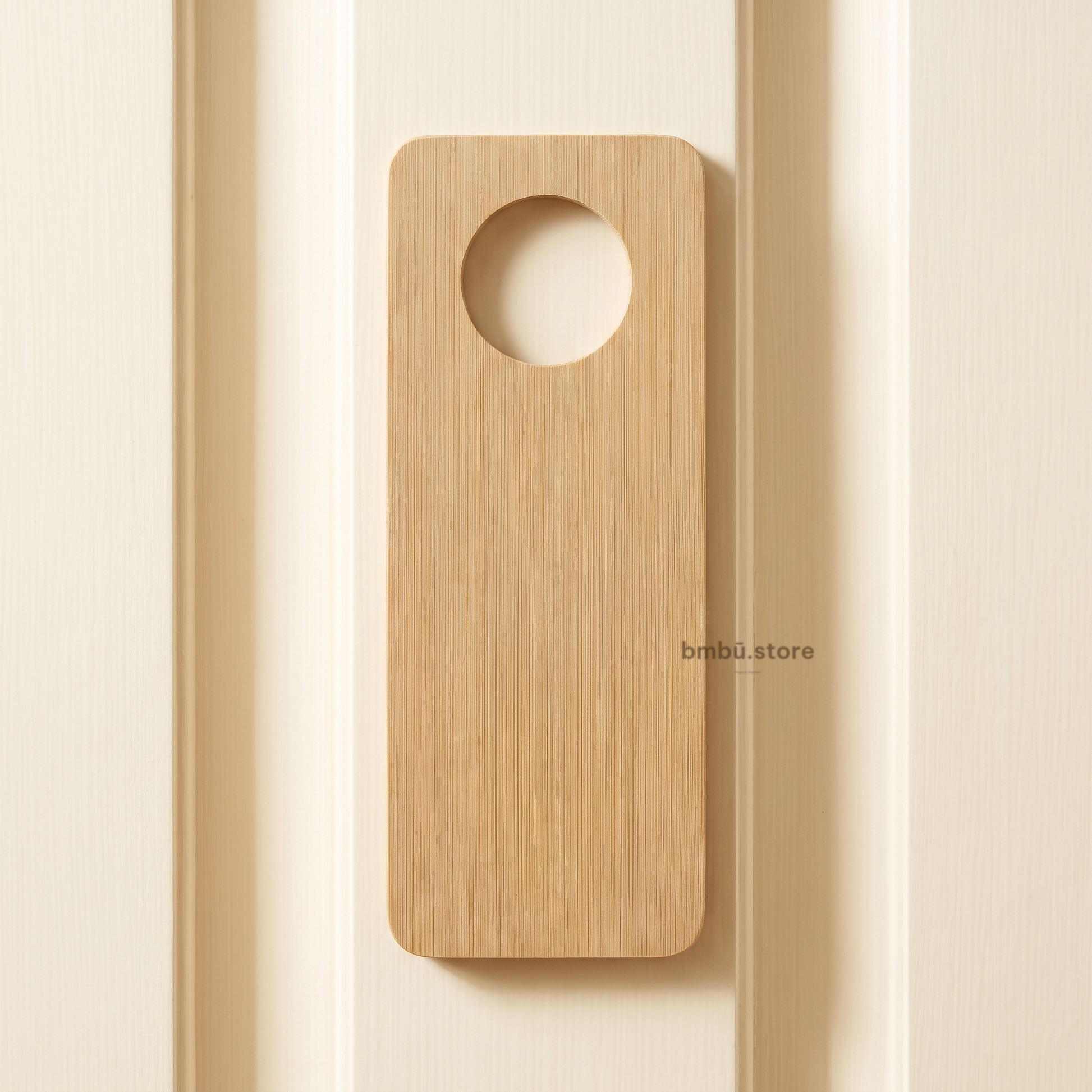 Bamboo door hanger brand face — bmbū.store wordmark