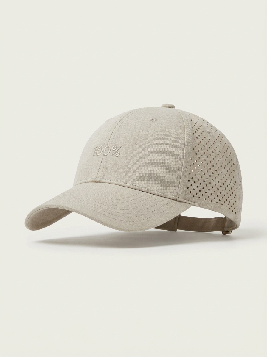 The Bmbū 100% Trucker Cap — front, laser-perforated undyed greige bamboo lyocell with flat tone-on-tone 100% logo